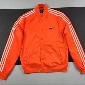 ADIDAS ORIGINALS X Pharrell Williams neon orange track jacket